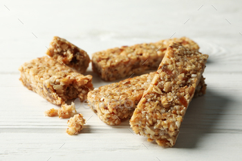 Tasty granola bars on white wooden background / Photodune, Misc