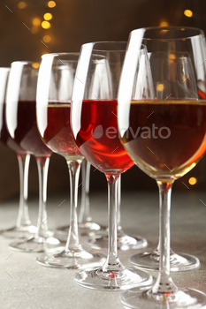 Glasses of wine against background with blurred lights / Photodune, Misc