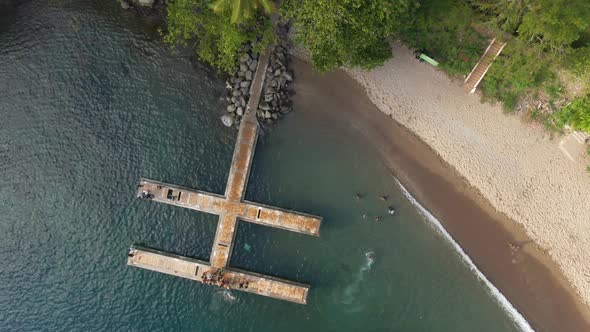 Local dock and beach Top-down drone video