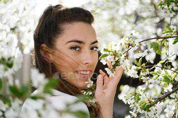 Spring time, Natural beauty. Candid portrait of young women in cherry blooming garden. Pretty woman / Photodune, Misc