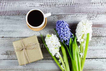 Morning coffee mug for breakfast, gift box, white and blue hyacinth on shabby wooden background / Photodune, Misc