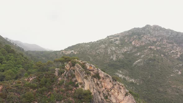 Drone Flight Over Mountains Under Grey Sky