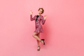 Full-length shot of flirtatious girl in brilliant dress on pink background - PhotoDune Item for Sale
