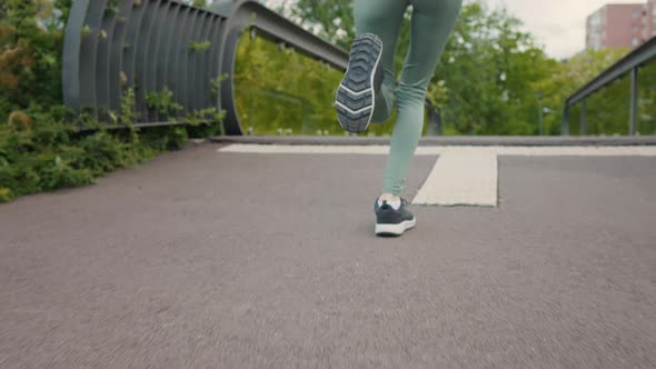 Back view of running feet ,intense cardio workout exercise.