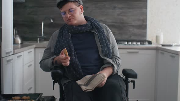 Man in Wheelchair Trying Homemade Cookies