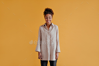 Front view of gorgeous african american girl in long shirt. Trendy black woman in casual attire iso / Photodune, Misc