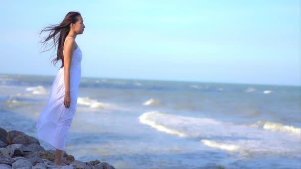 Asian woman enjoy around beautiful beach sea ocean