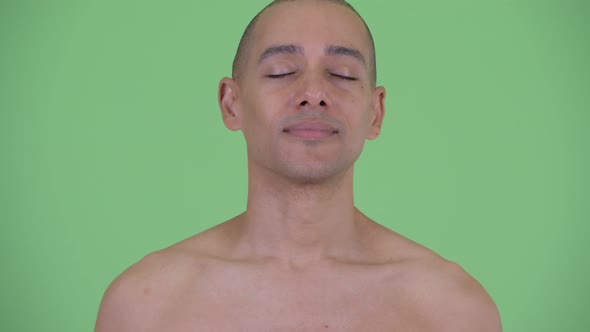 Face of Happy Bald Multi Ethnic Shirtless Man Relaxing with Eyes Closed