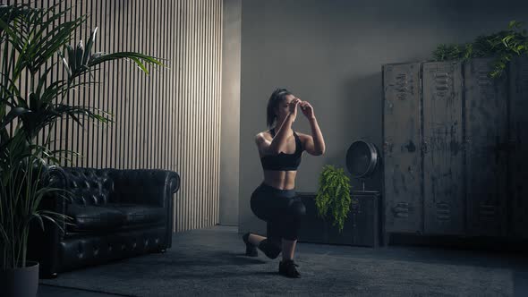 Sporty and Beautiful Woman Doing Forward Lunge at Home in Sportswear. Slow Motion.