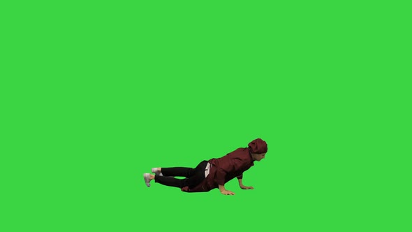 Male Chef Cook in Red Uniform Break Dancing Against Green Background on a Green Screen, Chroma Key.