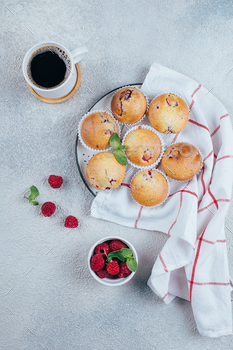 Delicious breakfast food concept. Coffee, raspberry muffins on concrete table. Top view, flat lay / Photodune, Misc