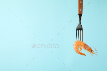 Fork with shrimp on blue background, space for text / Photodune, Misc