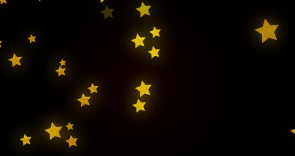 Animation of glowing golden stars twinkling and moving in hypnotic motion on black background