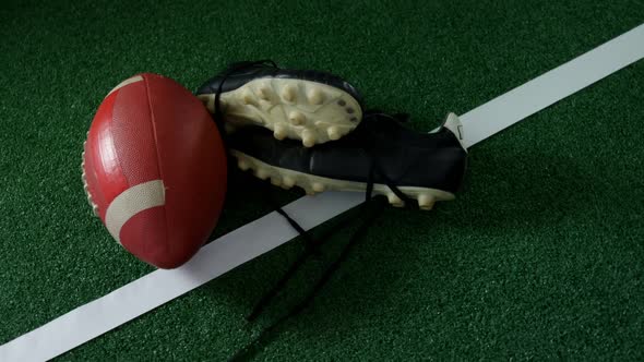 Rugby ball and cleat on marking line 4k