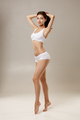 Woman with natural slim tanned body in underwear - PhotoDune Item for Sale