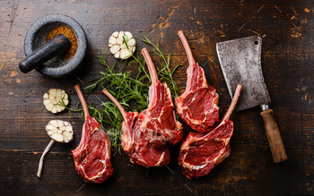 Raw fresh meat Veal ribs, spices and Meat cleaver on wooden background / Photodune, Misc