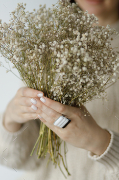 Fashionable female in sweater with unusual fused glass accessories and white manicure. Beauty. Care / Photodune, Misc