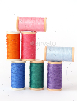 Colorful threads on the table / Photodune, Misc