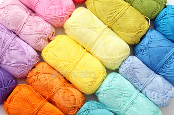 Colorful threads on the table / Photodune, Misc