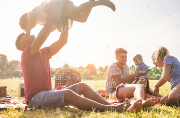 Happy families doing picnic in nature park outdoor / Photodune, Misc