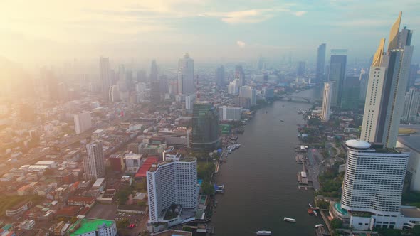 4K : Drones fly over the Chao Phraya River, buildings and business districts