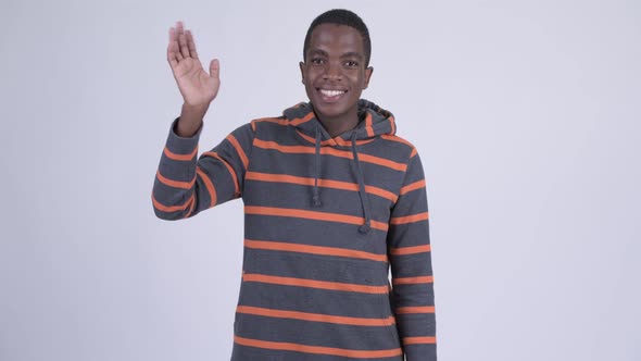 Young Happy African Man Smiling and Waving Hand