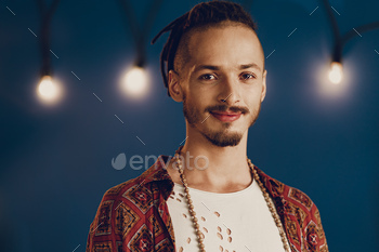 Close-up portrait of a young stylish man with dreadlocks / Photodune, Misc