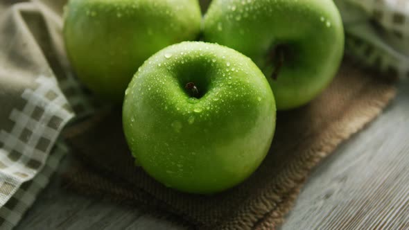 Green Apples in Water Drops