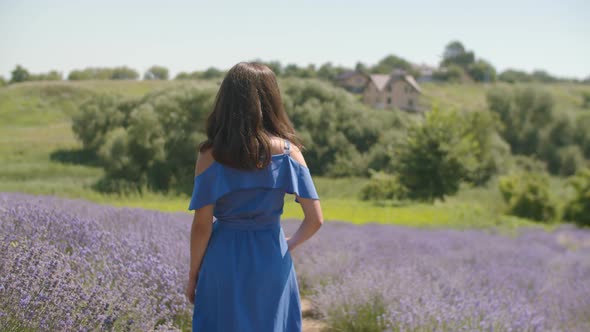 Stunning Smiling Woman Beckoning in Lavender Field