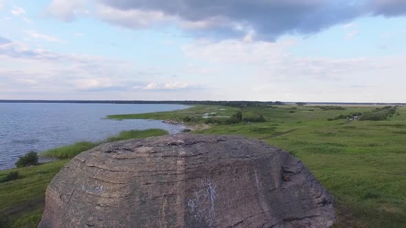 Aerial view of Huge stones (rocks) in a vast field by the lake 04