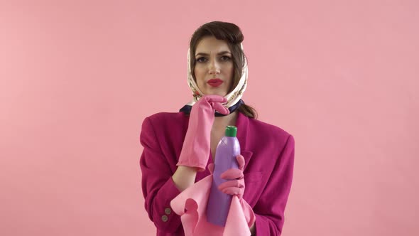 The Woman is Thinking About How to Start Cleaning in Gloves Household Chemicals