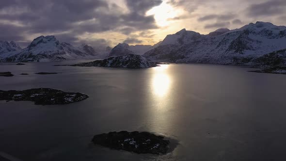 Fjord and Mountains at Sunset in Winter. Lofoten Islands, Norway. Aerial View