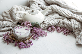 Spring home still life with a cup of milk and lilac flowers copy space. / Photodune, Misc