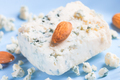 Blue cheese and almonds on blue plate - PhotoDune Item for Sale