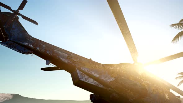 Old Rusted Military Helicopter in the Desert at Sunset