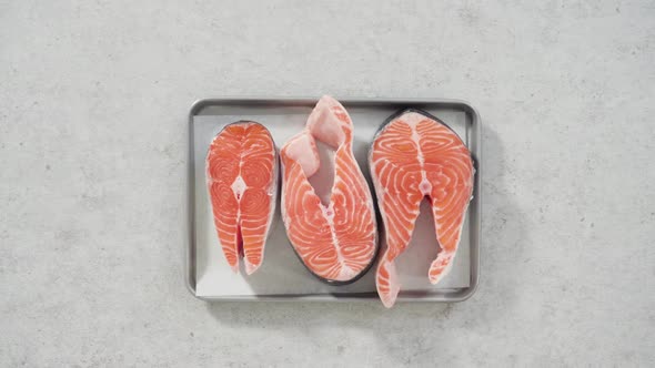 Farmraised Salmon Steaks on a Cooking Tray with a Parchment Paper