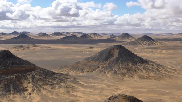 Wide view of the hills in the Black Desert, Egypt.