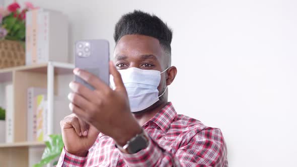 Coronavirus. African man in quarantine for coronavirus wearing protective mask