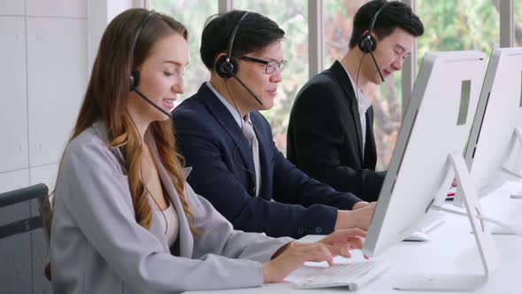 Business People Wearing Headset Working in Office