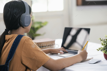 Happy asian girl learning online at home / Photodune, Misc