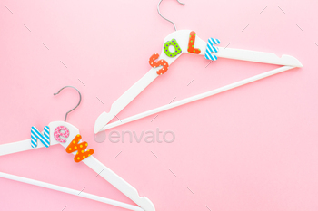 White hangers with sale text on pink background / Photodune, Misc