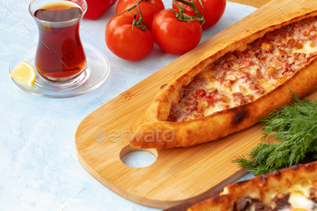 Close up of Turkish Pide bread on wooden table / Photodune, Misc