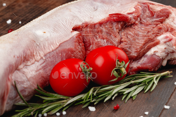 Raw beef tongue on dark wooden board / Photodune, Misc