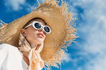 beautiful girl posing in trendy sunglasses, silk scarf and straw hat / Photodune, Misc