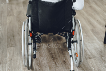 Unrecognizable man sitting in wheelchair close up / Photodune, Misc