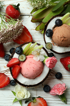 Concept of delicious fruit ice cream on wooden table / Photodune, Misc
