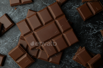 Tasty chocolate bars on black smokey background / Photodune, Misc