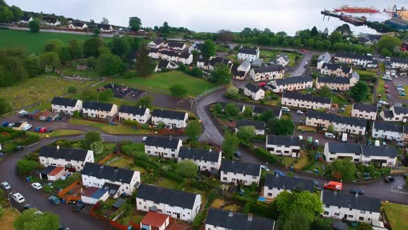 Cinematic tilting drone shot of scottish lakeside village