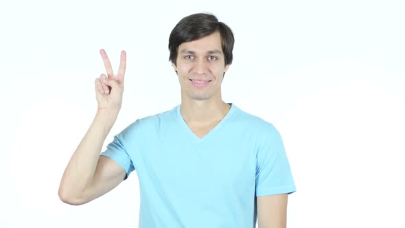 Victory Sign by Young Casual Man, White Background