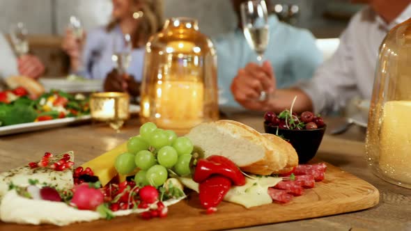 Group of friends having champagne at dinner table 4K 4k